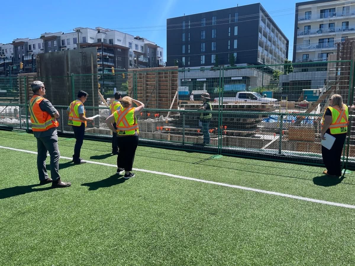 The new field house under construction beside the turf field