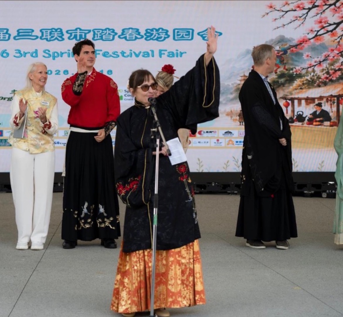 Meghan Lahti on stage in traditional dress at the Spring Festival Fair